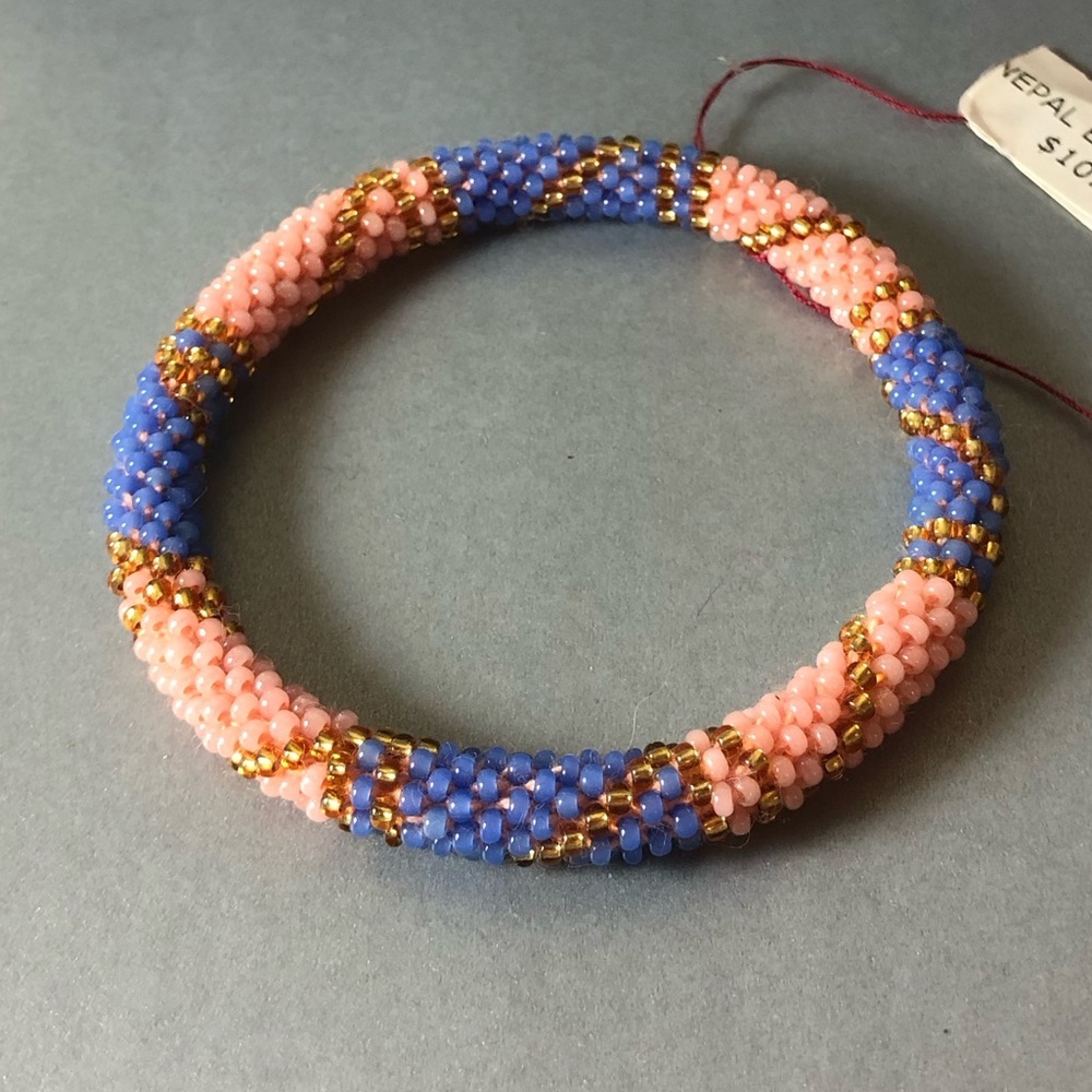 Beautiful handcrafted Blue pink gold beaded bracelet from Nepal